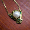 Emerald and Pearl 14 Karat Yellow Gold Shield Necklace